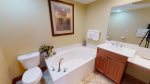 Bathroom can be accessed by the hallway and master bedroom 